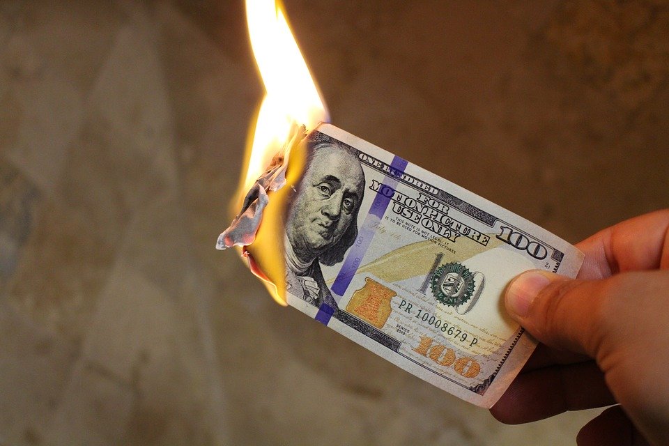 Photo of a burning dollar