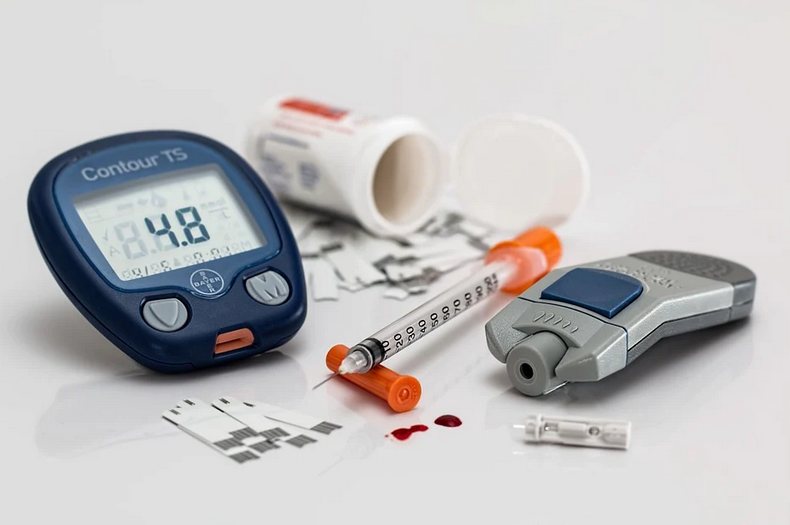 Diabetic test strips, lancets, and a glucose meter.